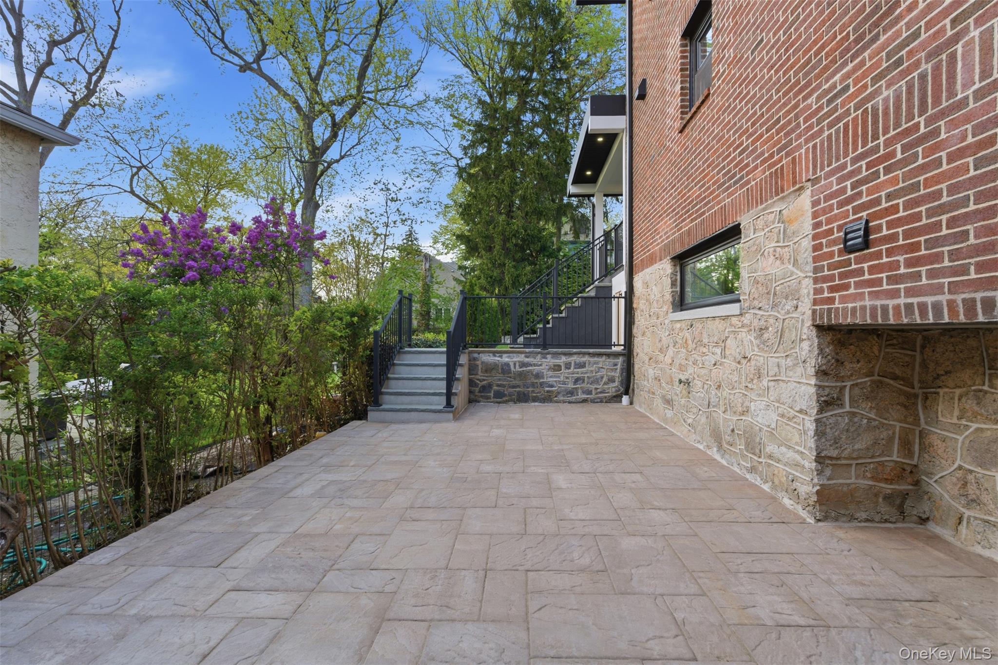 40 Calhoun Avenue New Rochelle, NY 10801 - Photo 38 of 49 Spacious outdoor patio featuring stone-finish pavers