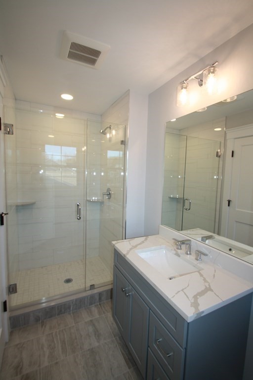 31 Helen Road Needham, MA 02492 - Photo 9 of 11 a bathroom with a sink shower and a mirror