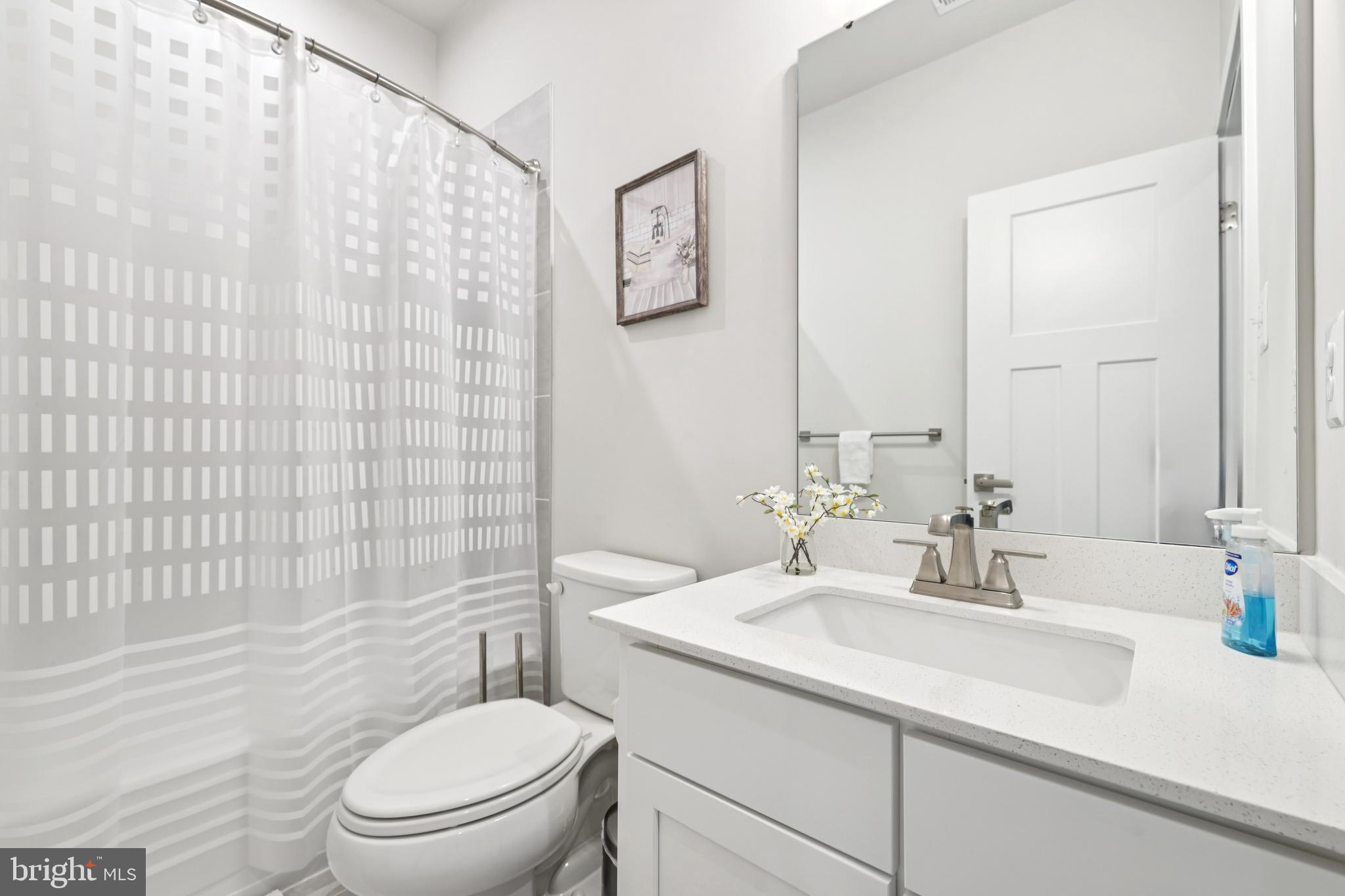 1716 Atlas Drive Frederick, MD 21702 - Photo 25 of 48 a bathroom with a sink a toilet and shower