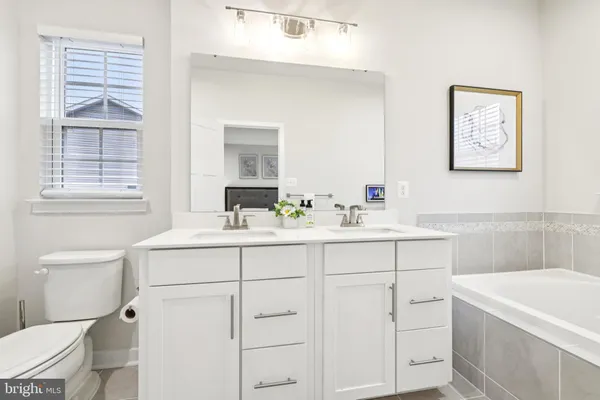 a picture of a bench in front of a wall