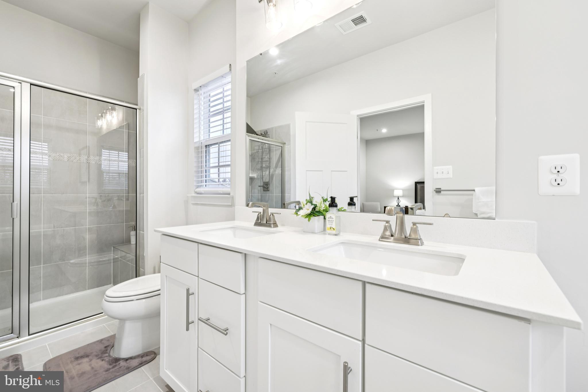 1716 Atlas Drive Frederick, MD 21702 - Photo 34 of 48 a bathroom with a sink a toilet and shower