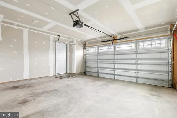 a front view of a building with a yard