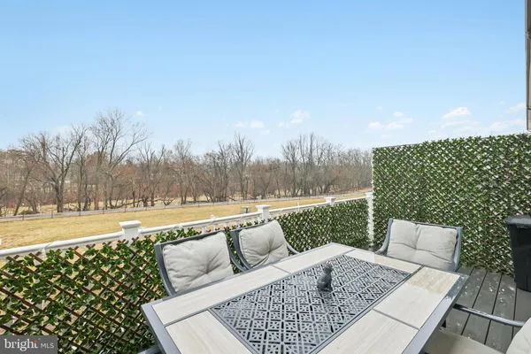 a picture of a bathroom with a refrigerator