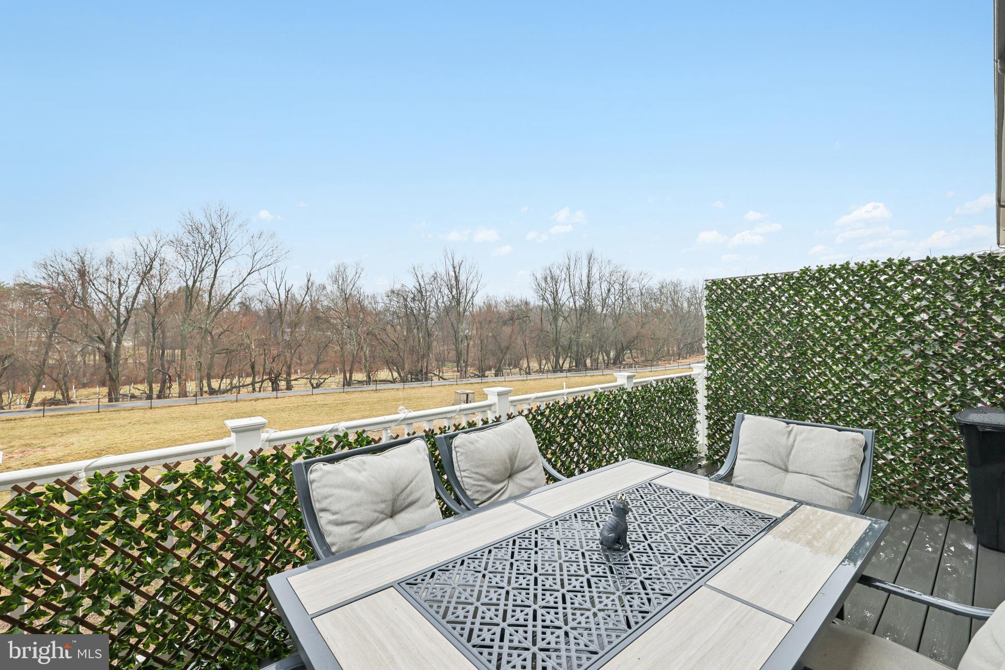 1716 Atlas Drive Frederick, MD 21702 - Photo 38 of 48 a view of a yard with furniture and trees