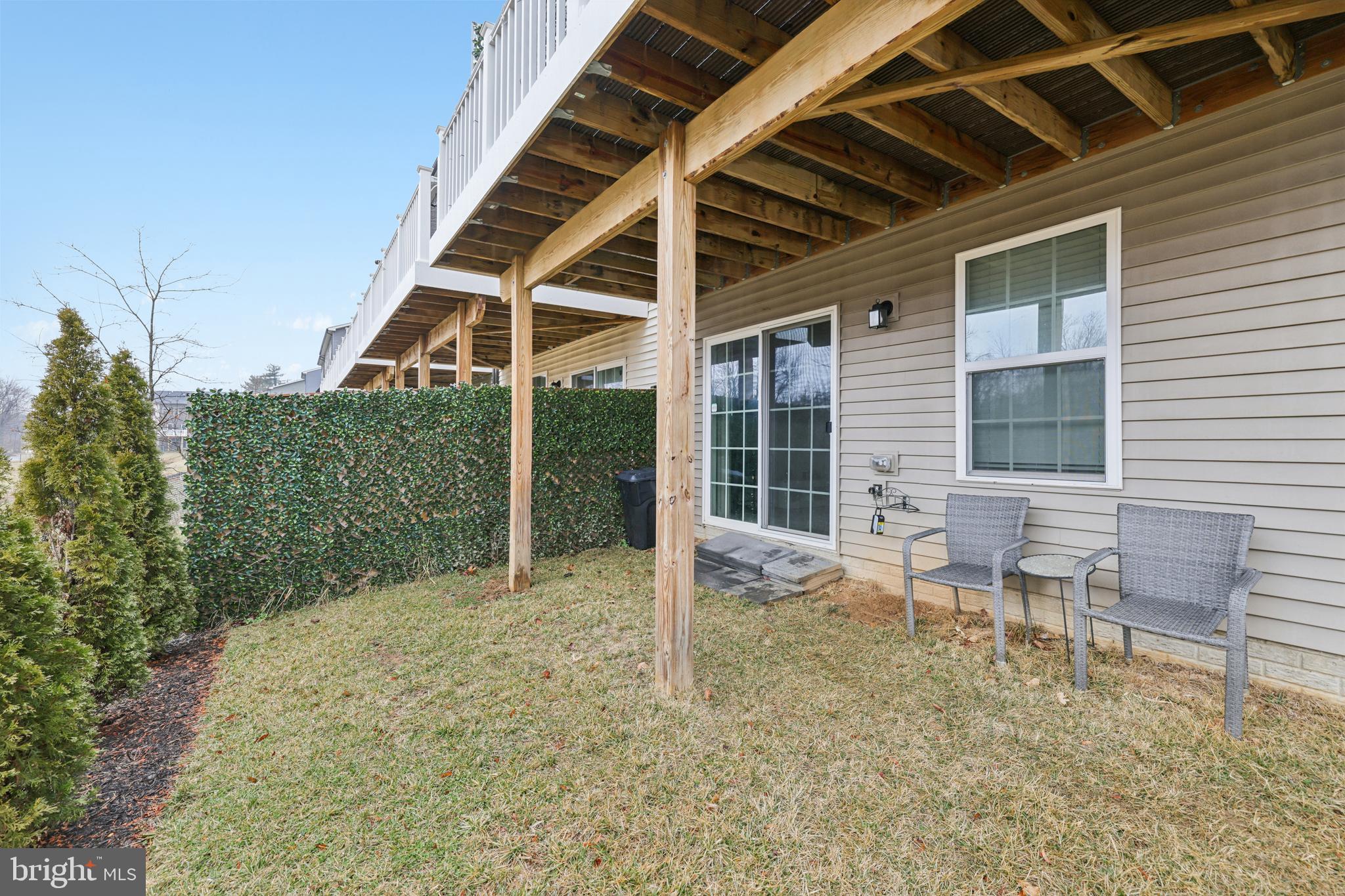 1716 Atlas Drive Frederick, MD 21702 - Photo 39 of 48 a view of a patio with table and chairs with wooden floor and fence