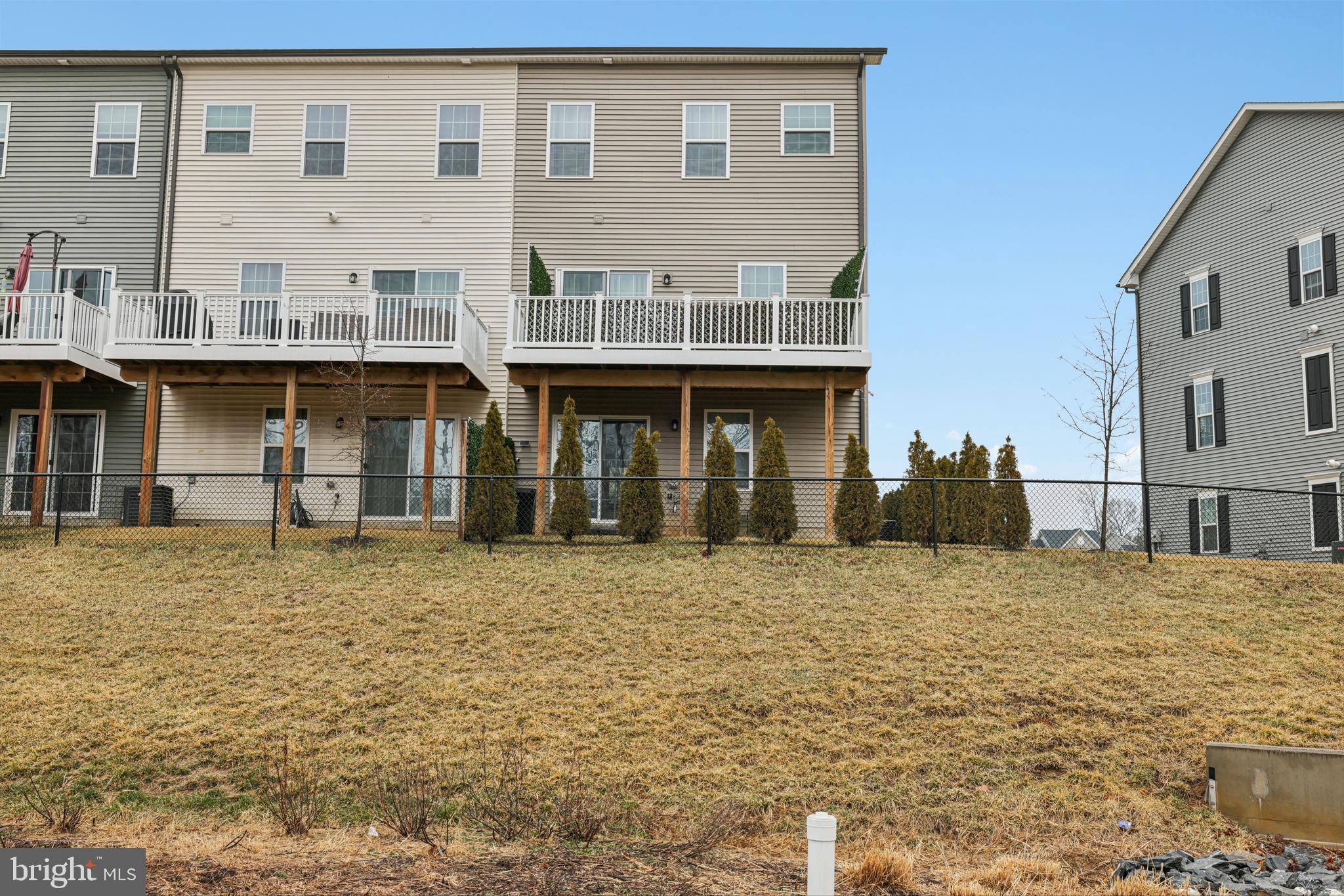 1716 Atlas Drive Frederick, MD 21702 - Photo 40 of 48 a front view of a building with a yard