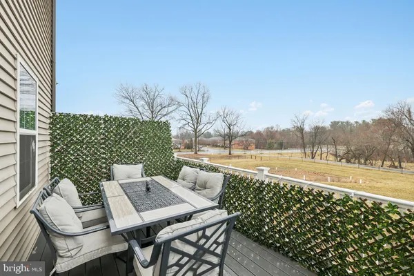 a view of swimming pool with seating space