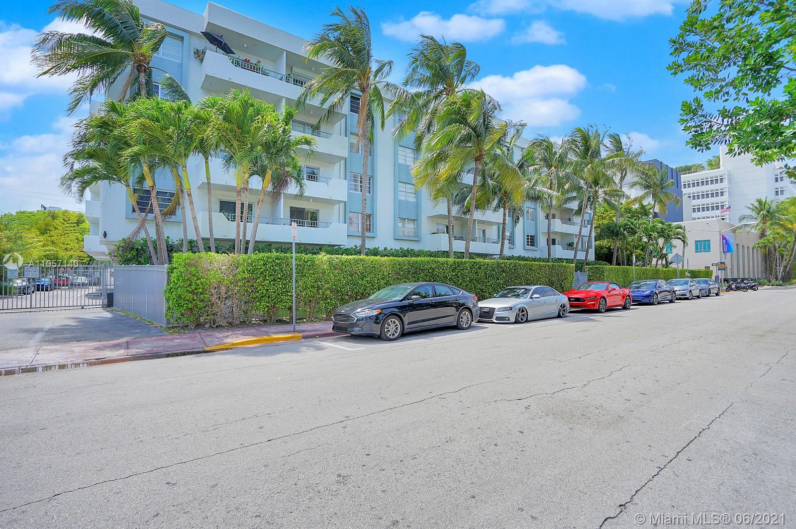 a view of street with parked cars