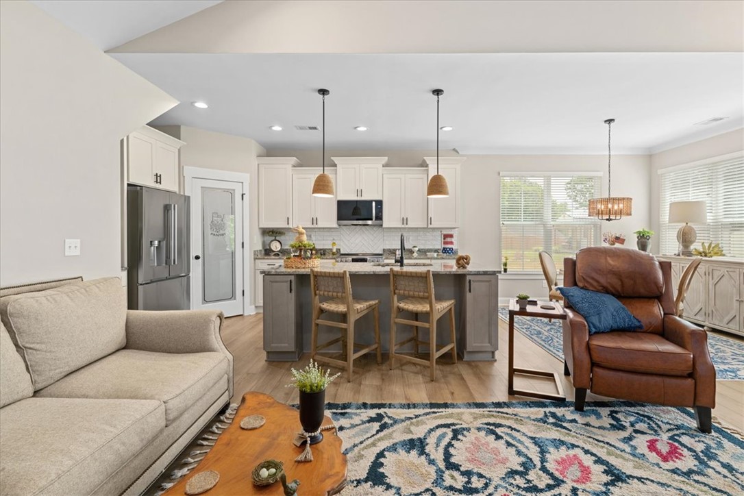 6834 Midway Road Pelzer, SC 29669 - Photo 14 of 50 This open-concept kitchen and living area offers seamless entertaining and daily living.