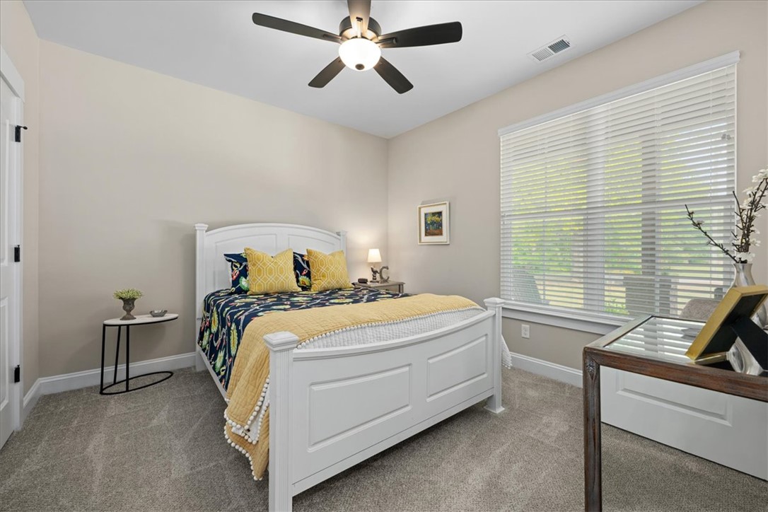 6834 Midway Road Pelzer, SC 29669 - Photo 31 of 50 This peaceful retreat features soft carpeting and a broad window for ample natural light.