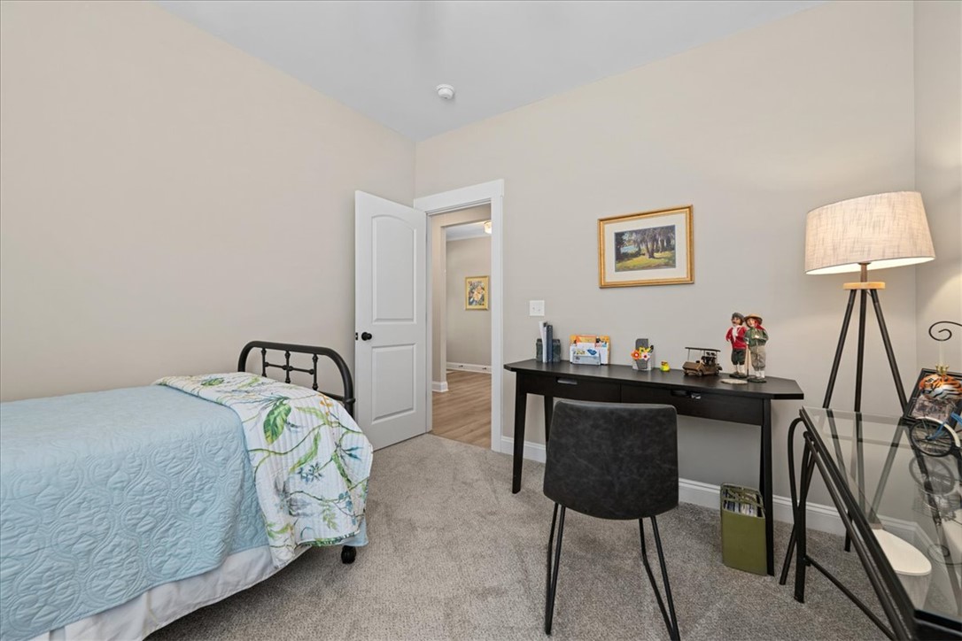 6834 Midway Road Pelzer, SC 29669 - Photo 36 of 50 This cozy room features soft carpeting and natural light, creating a comfortable and inviting atmosphere.