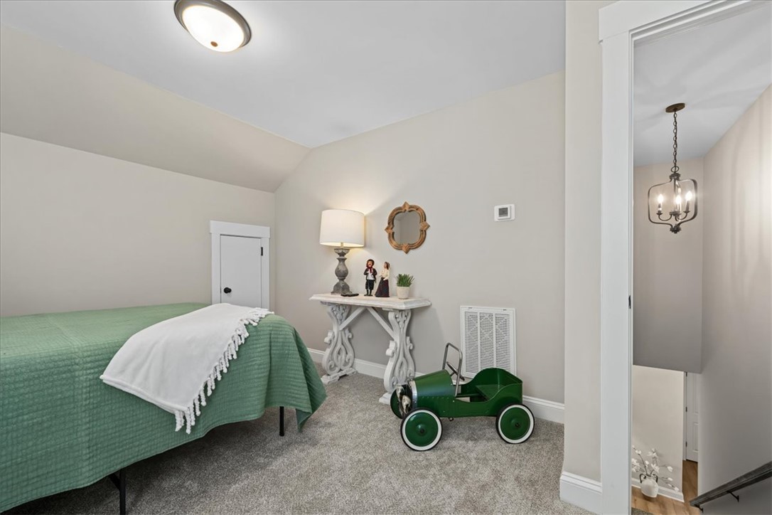 6834 Midway Road Pelzer, SC 29669 - Photo 40 of 50 An inviting bedroom with plush carpeting offers a cozy and serene personal retreat.