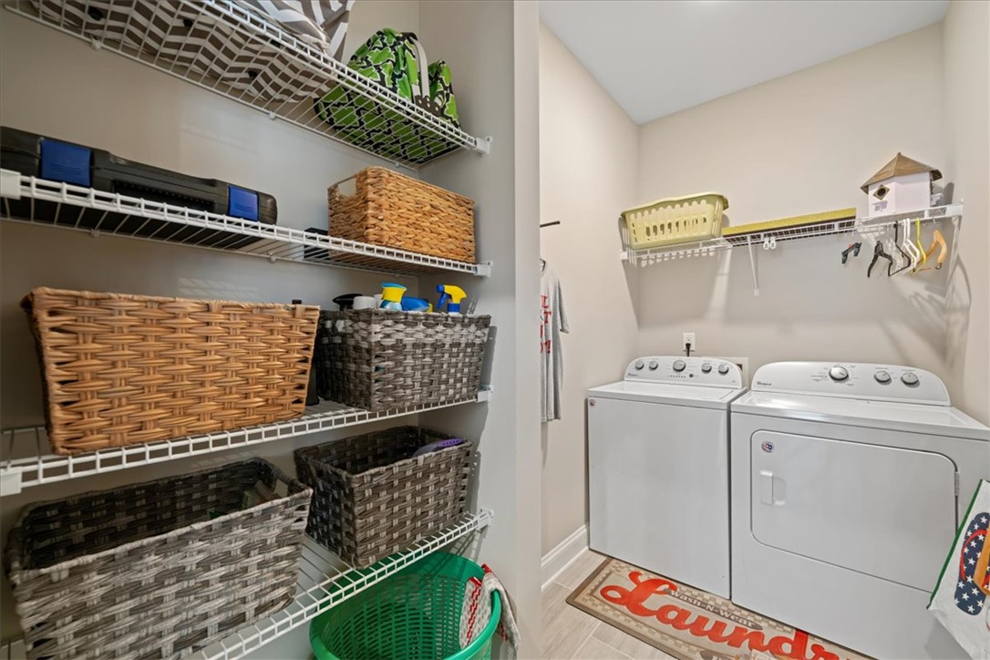 6834 Midway Road Pelzer, SC 29669 - Photo 41 of 50 This organized laundry area includes efficient appliances and convenient storage shelves.
