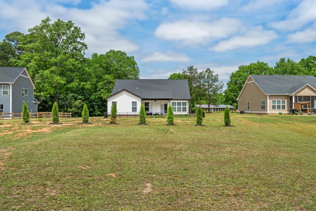 6834 Midway Road Pelzer, SC 29669 - Photo 47 of 50 A new build property features a spacious backyard, offering abundant outdoor possibilities.