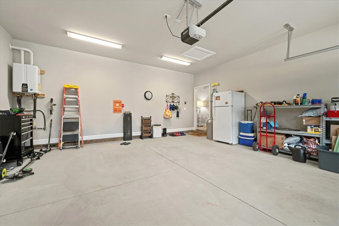6834 Midway Road Pelzer, SC 29669 - Photo 48 of 50 This spacious garage offers ample storage and utility, complete with a water heater.