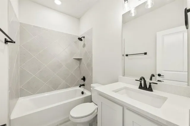 a bathroom with a sink a toilet and a bathtub