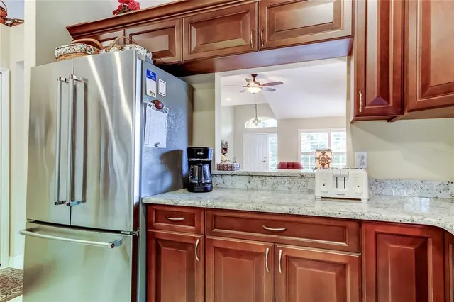 a kitchen with stainless steel appliances a stove a sink a microwave and cabinets