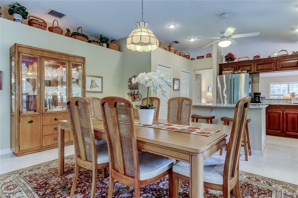 1610 Cortleigh Drive Trinity, FL 34655 - Photo 25 of 72 a view of a dining room with furniture window and wooden floor
