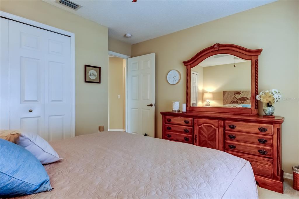 1610 Cortleigh Drive Trinity, FL 34655 - Photo 31 of 72 a bedroom with a bed and a dresser