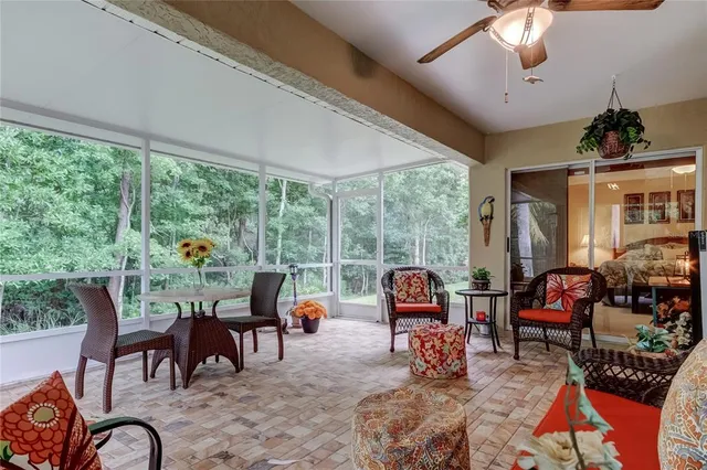 front view of a house with a yard and potted plants