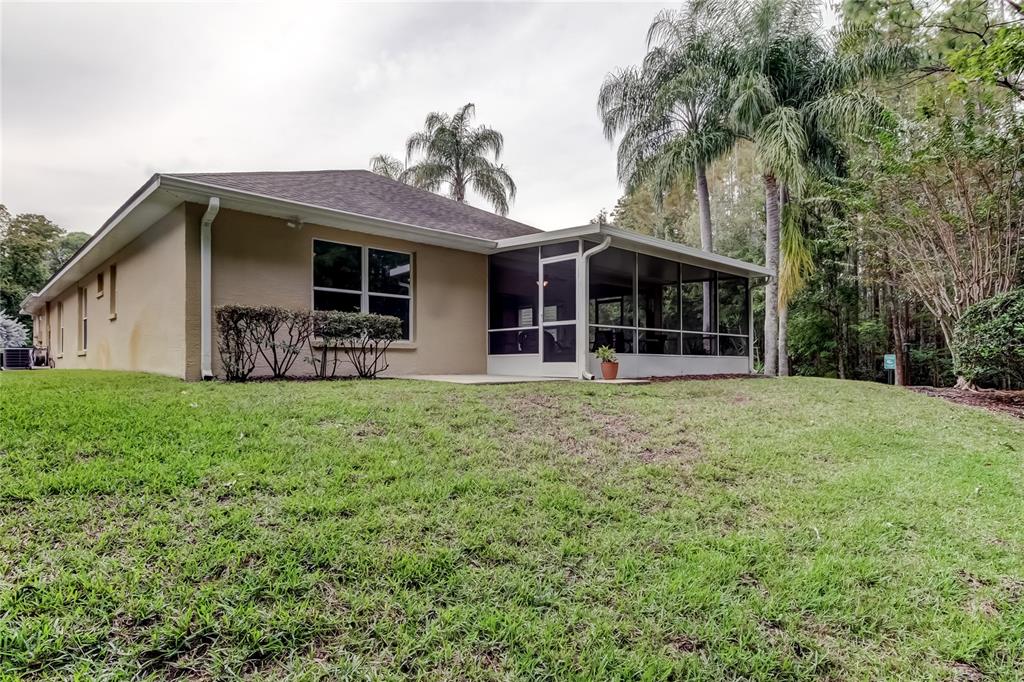 1610 Cortleigh Drive Trinity, FL 34655 - Photo 56 of 72 a view of a house with backyard and porch