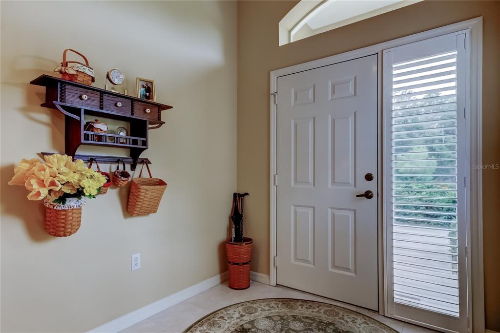 1610 Cortleigh Drive Trinity, FL 34655 - Photo 6 of 72 a bedroom with a bed and a window