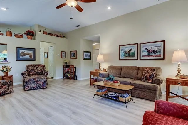 a living room with furniture and a lamp