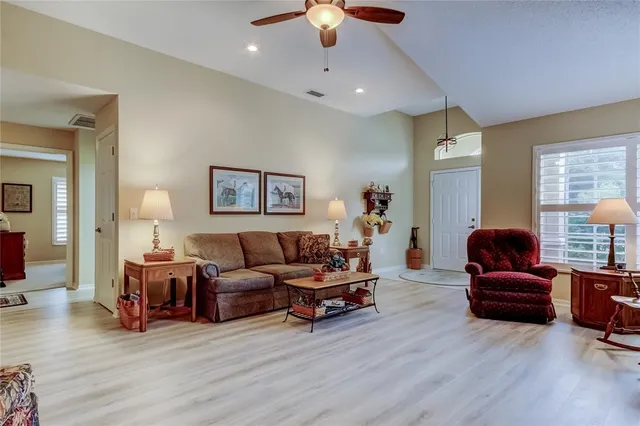 a bedroom with furniture and a flat screen tv