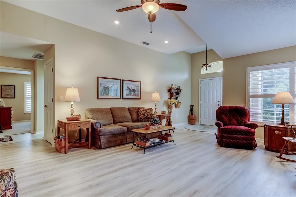 1610 Cortleigh Drive Trinity, FL 34655 - Photo 10 of 72 a living room with furniture and wooden floor