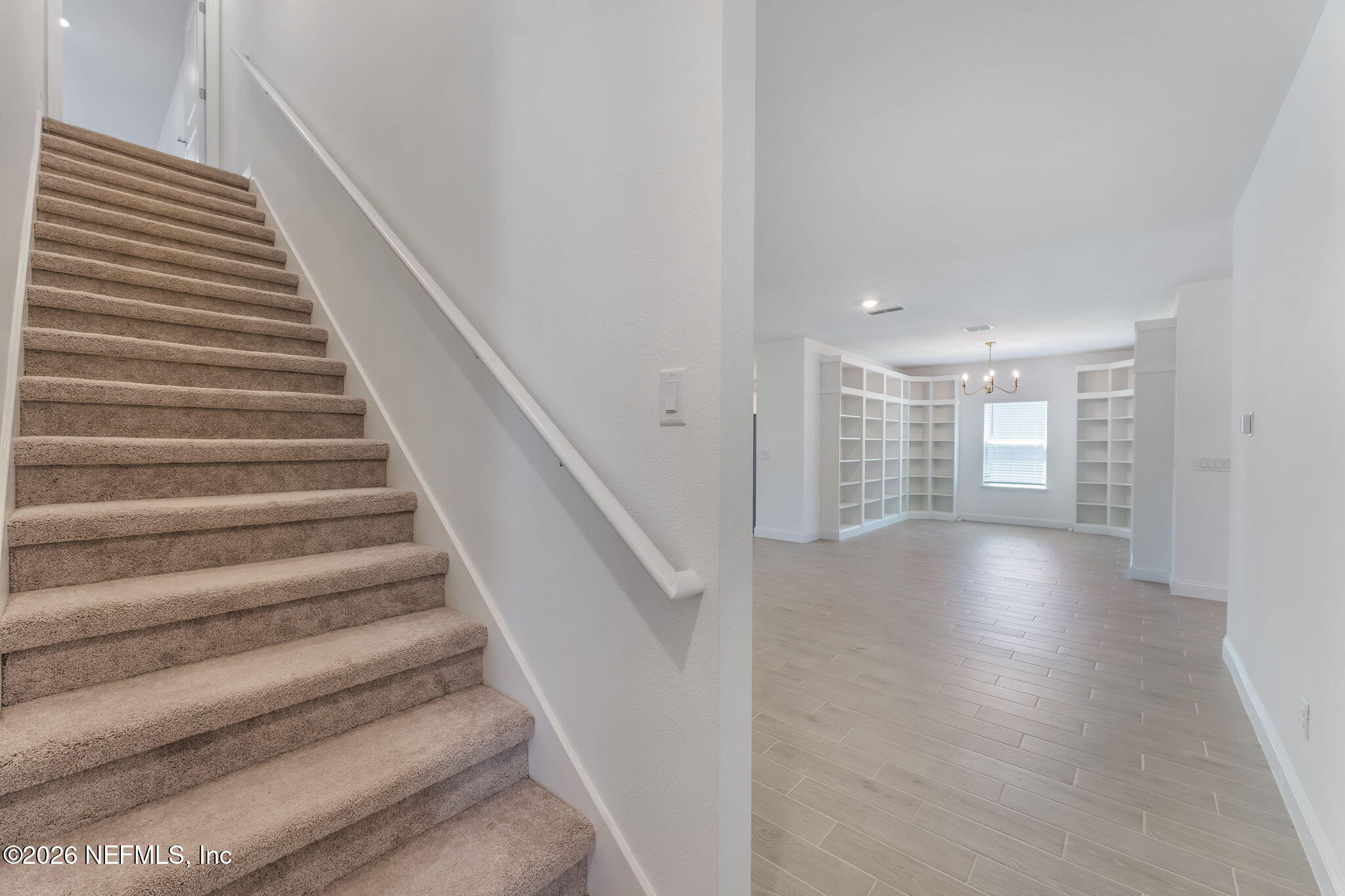 75776 Estuary Way Yulee, FL 32097 - Photo 14 of 20 a view of entryway and hall with wooden floor