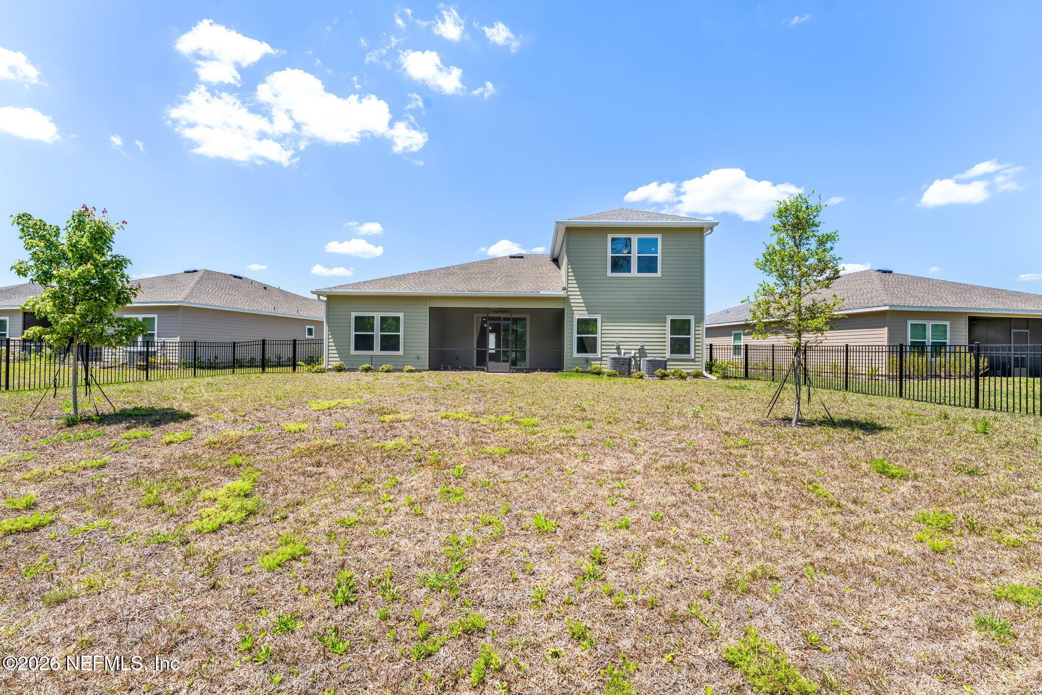 75776 Estuary Way Yulee, FL 32097 - Photo 16 of 20 a front view of a house with a garden