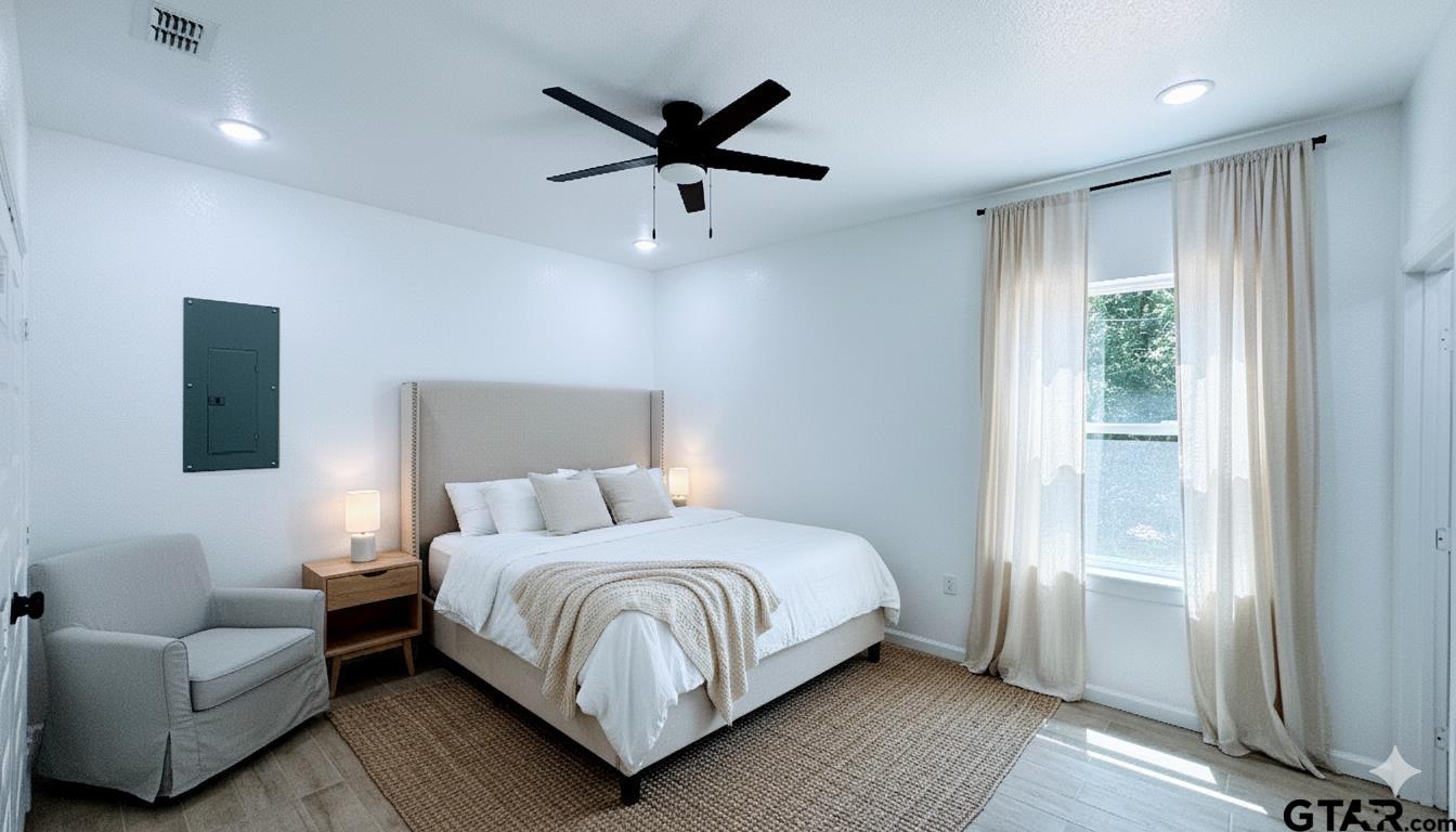 20428 High Point Drive Flint, TX 75762 - Photo 7 of 18 a bedroom with a bed couch and window