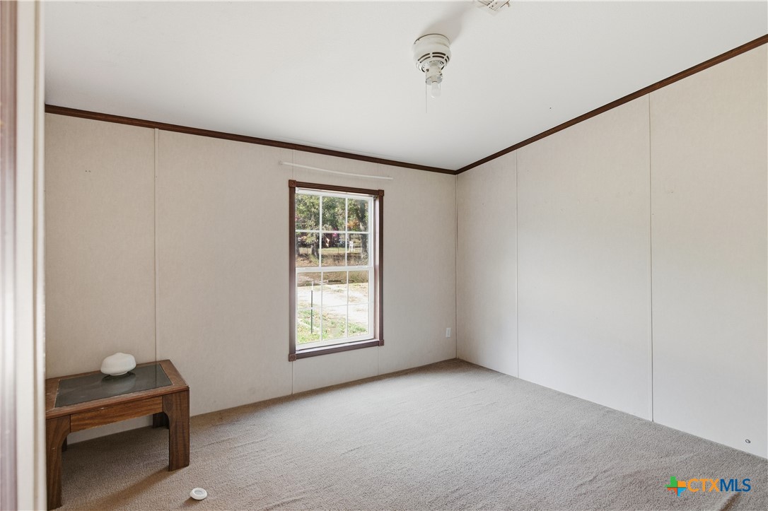780 Oak Tree Road Seguin, TX 78155 - Photo 11 of 40 an empty room with windows