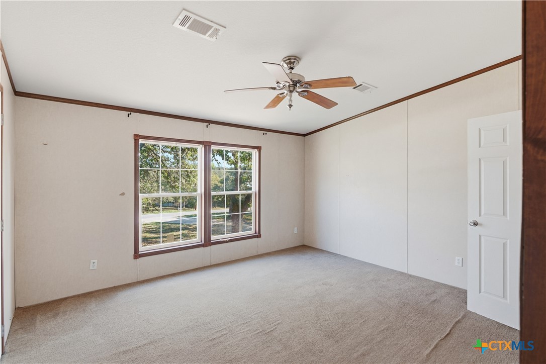 780 Oak Tree Road Seguin, TX 78155 - Photo 16 of 40 a view of room with a ceiling fan and window