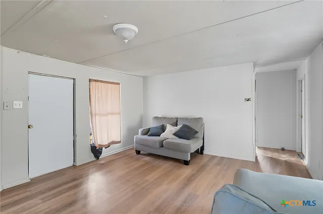 a living room with furniture and a couch