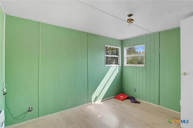 a bedroom with window and entryway