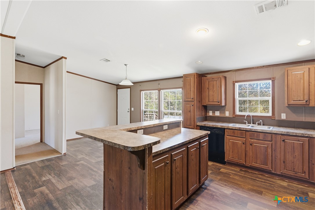 780 Oak Tree Road Seguin, TX 78155 - Photo 4 of 40 a kitchen that has a sink and a stove in it