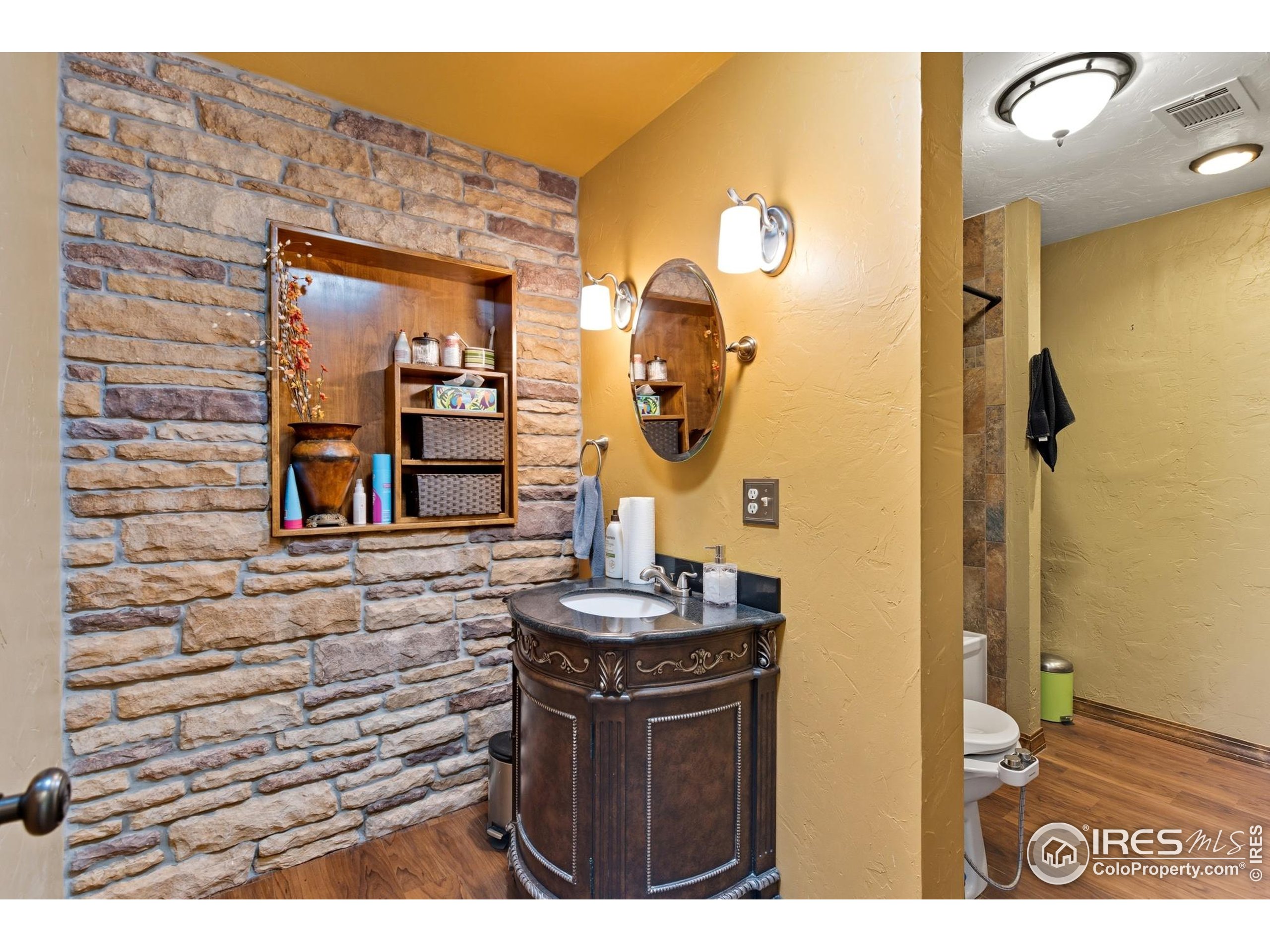 103 West Main Street Pierce, CO 80650 - Photo 16 of 47 a bathroom with a sink and a mirror