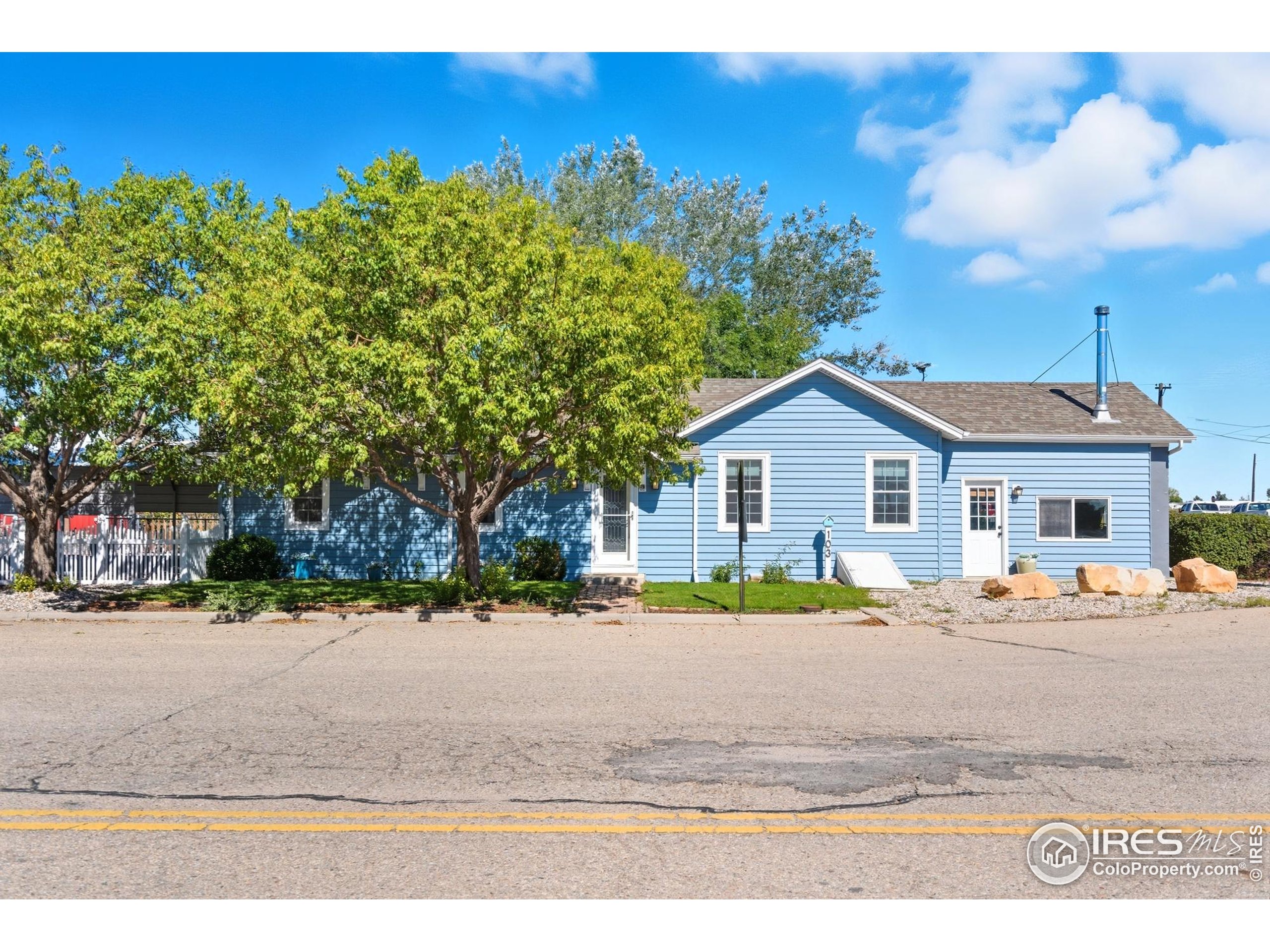 103 West Main Street Pierce, CO 80650 - Photo 2 of 47 a house view with a outdoor space