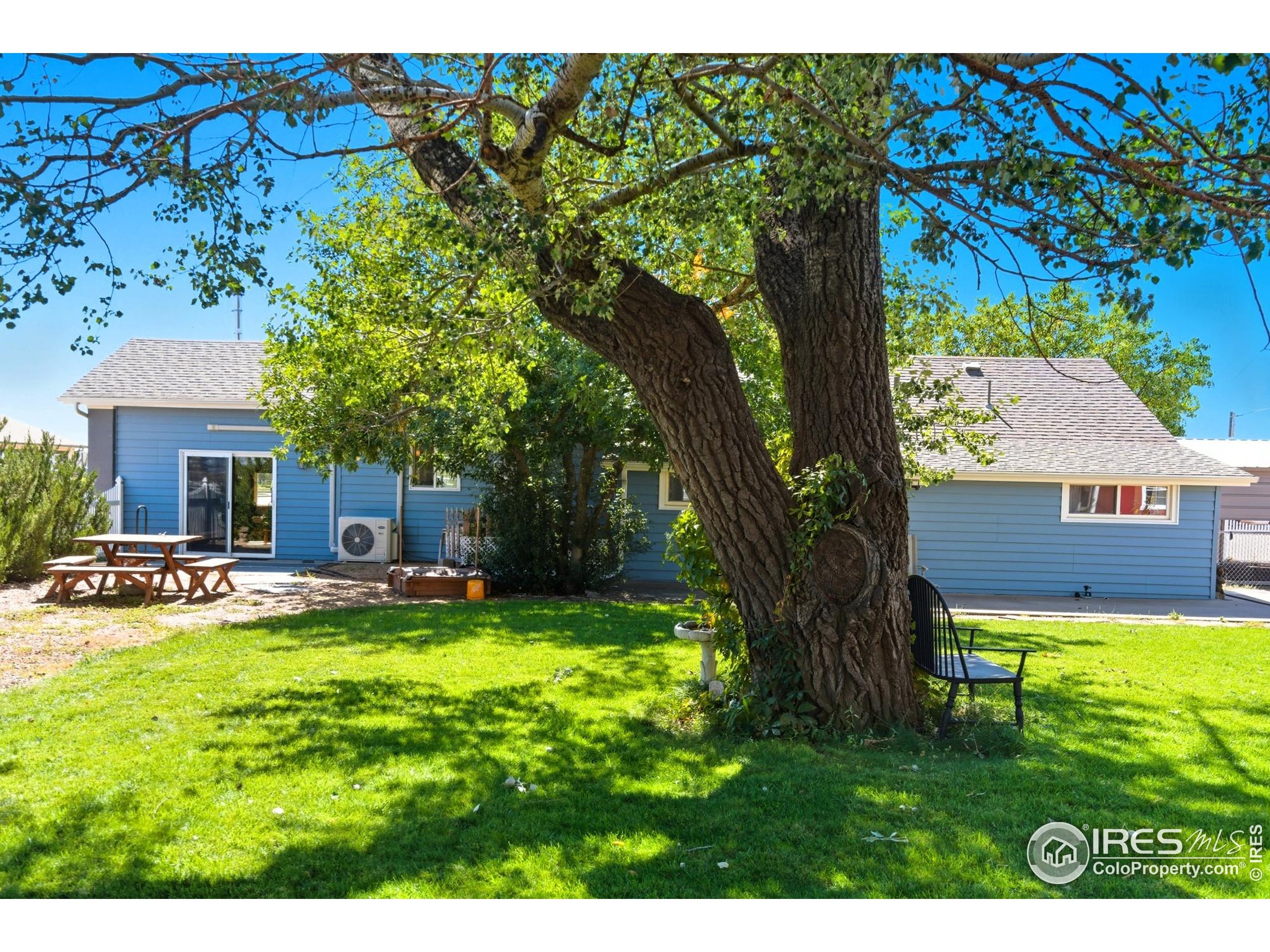 103 West Main Street Pierce, CO 80650 - Photo 26 of 47 a view of house with yard and sitting area