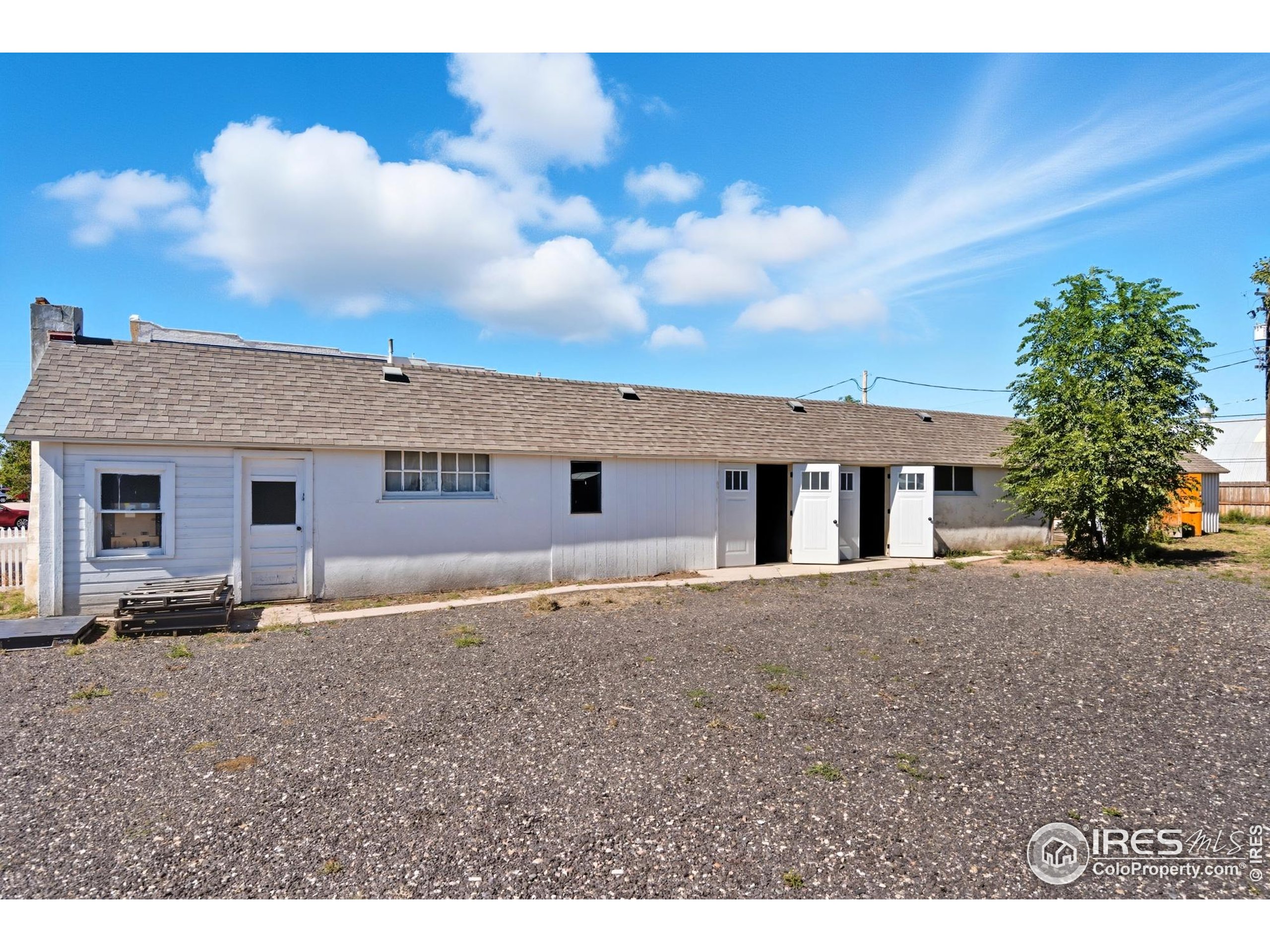 103 West Main Street Pierce, CO 80650 - Photo 27 of 47 a front view of a house with a yard