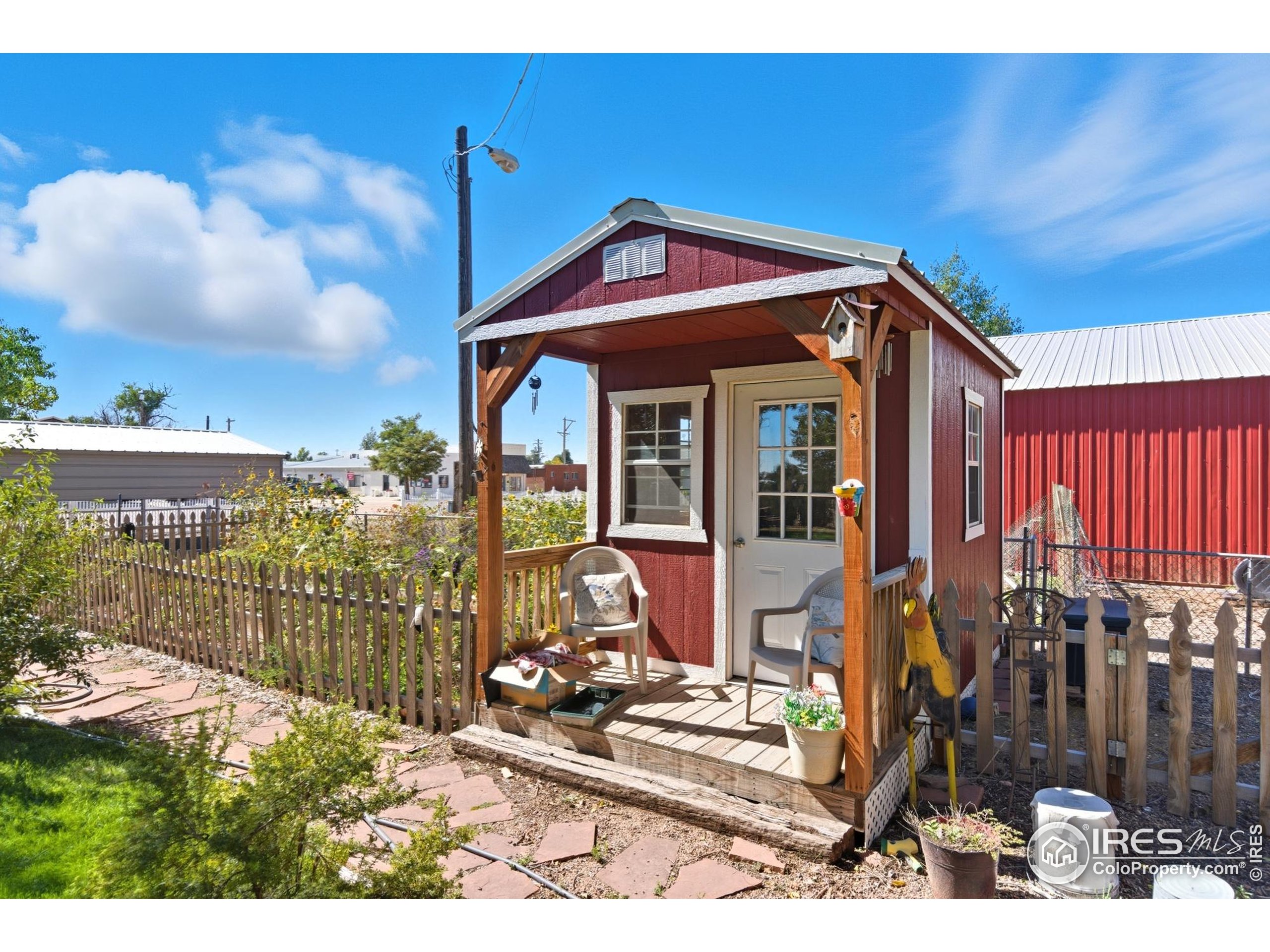 103 West Main Street Pierce, CO 80650 - Photo 29 of 47 a front view of a house with a porch
