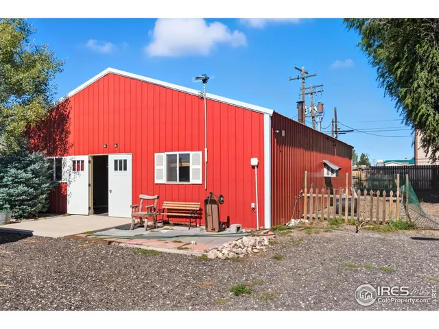 a backyard of a house with barbeque oven