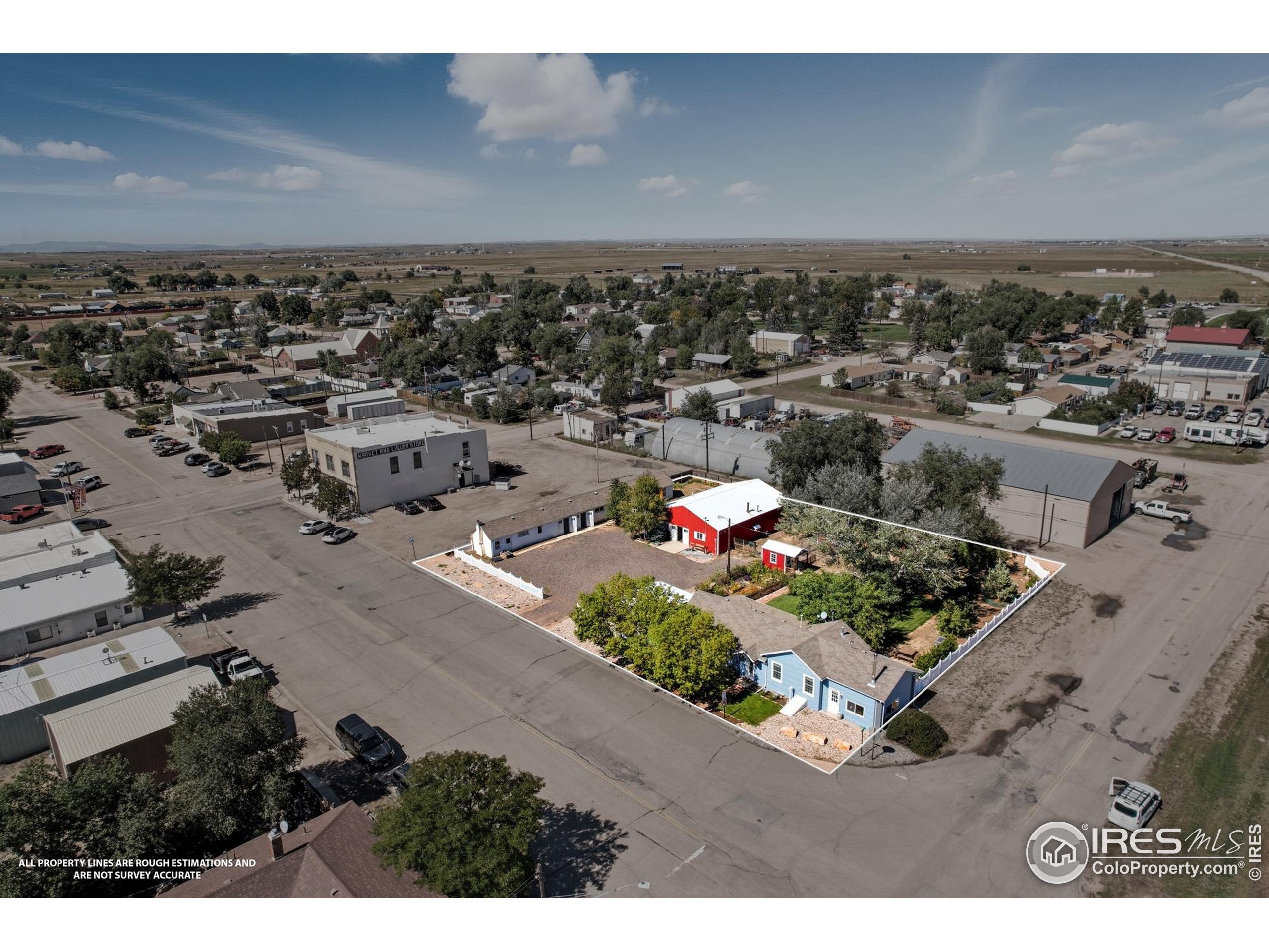 103 West Main Street Pierce, CO 80650 - Photo 41 of 47 an aerial view of a house with a garden