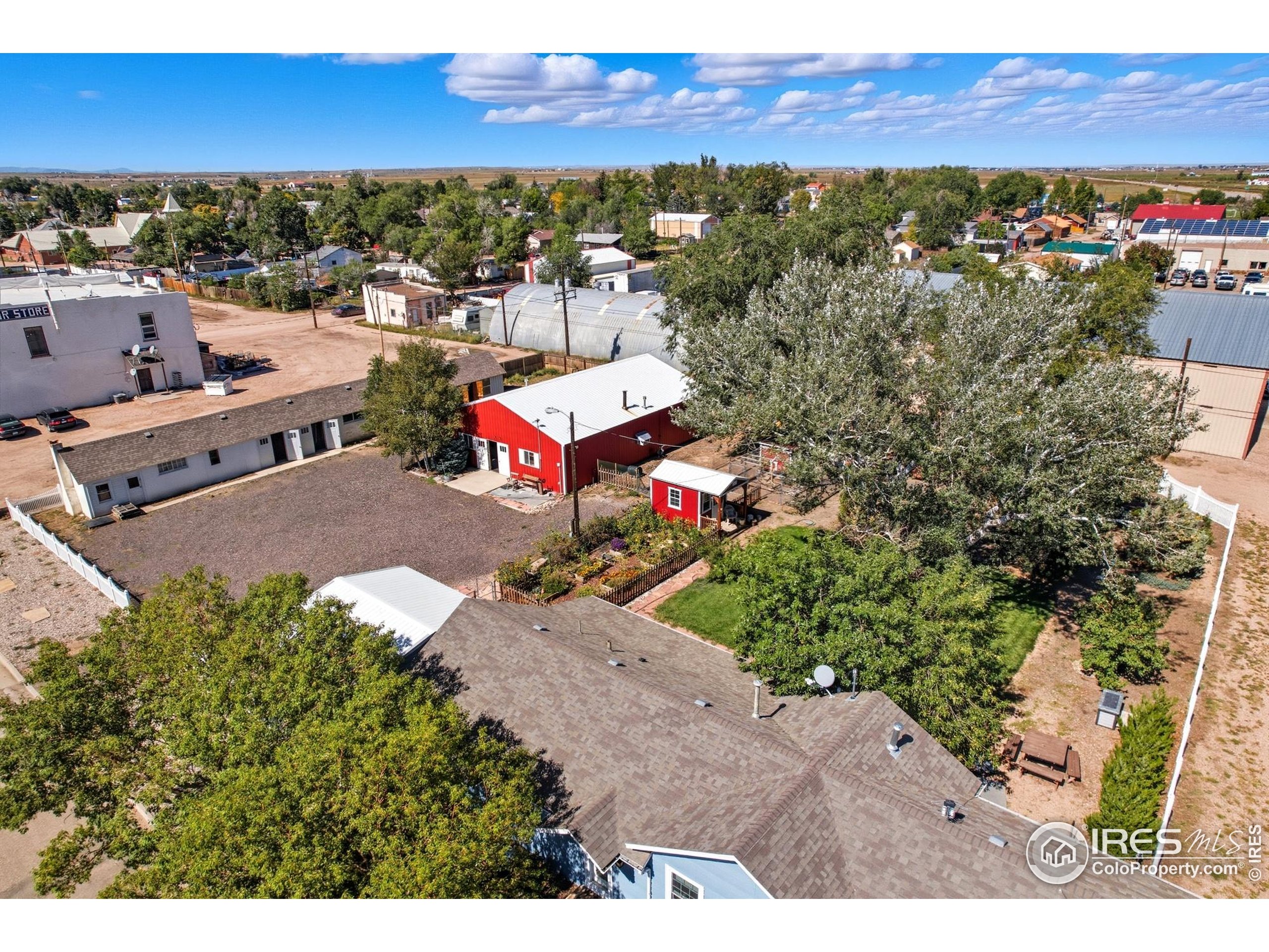 103 West Main Street Pierce, CO 80650 - Photo 42 of 47 a view of a house with a yard