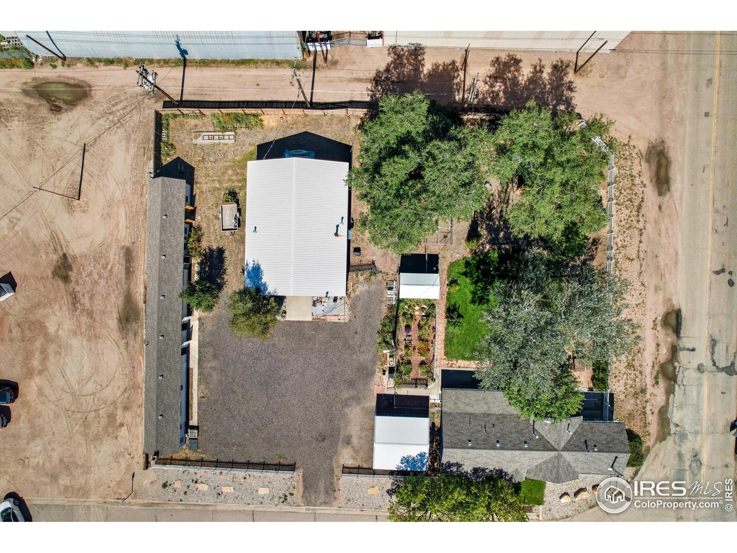 103 West Main Street Pierce, CO 80650 - Photo 46 of 47 an aerial view of a house with a yard and garden