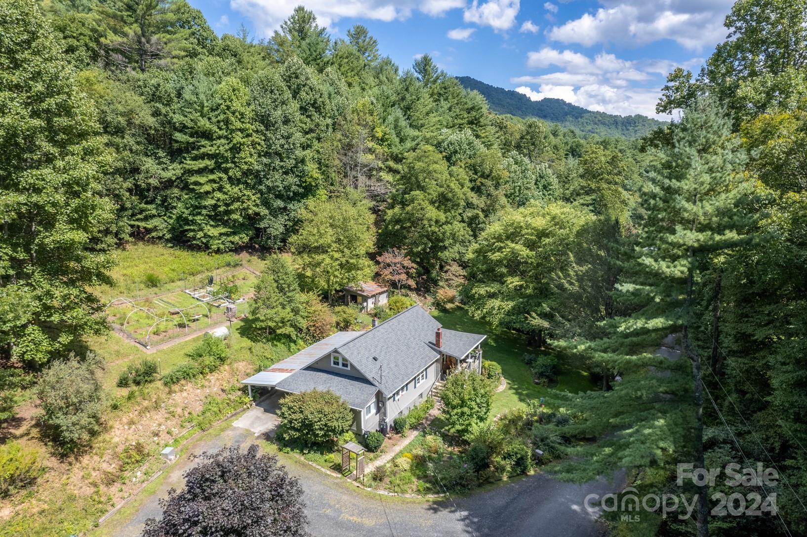 296 Sparks Road Bakersville, NC 28705 - Photo 1 of 47 an aerial view of a house with a yard