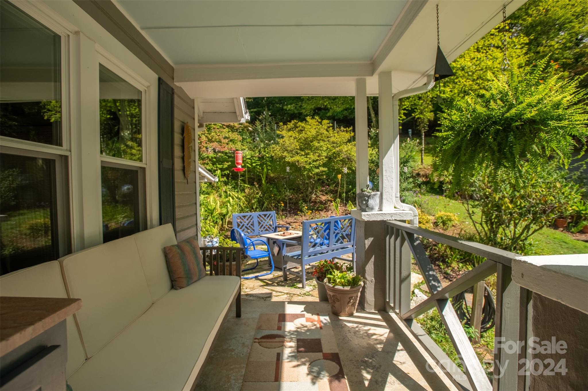 296 Sparks Road Bakersville, NC 28705 - Photo 12 of 47 a balcony with furniture and a potted plant