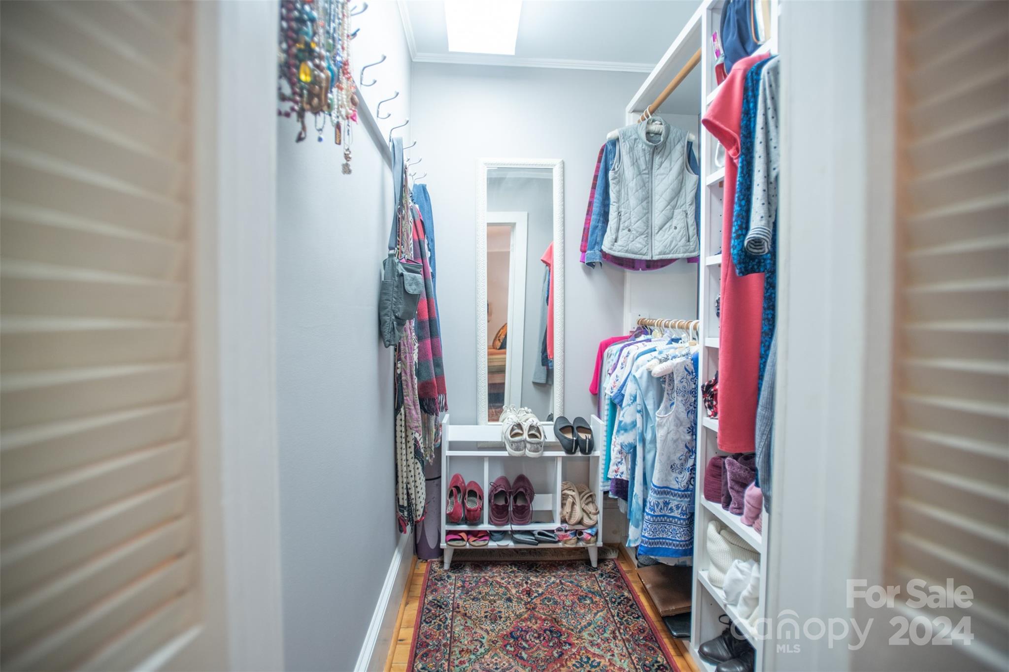 296 Sparks Road Bakersville, NC 28705 - Photo 13 of 47 a view of walk in closet with clothes