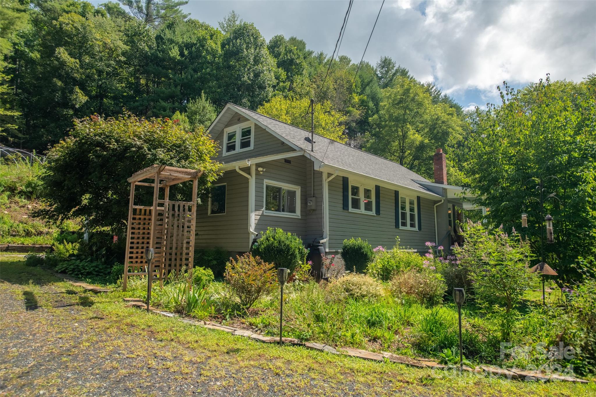 296 Sparks Road Bakersville, NC 28705 - Photo 16 of 47 a front view of house with yard and green space